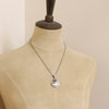 A mannequin wearing the mohave white buffalo turquoise heart and succulent necklace with the chain option