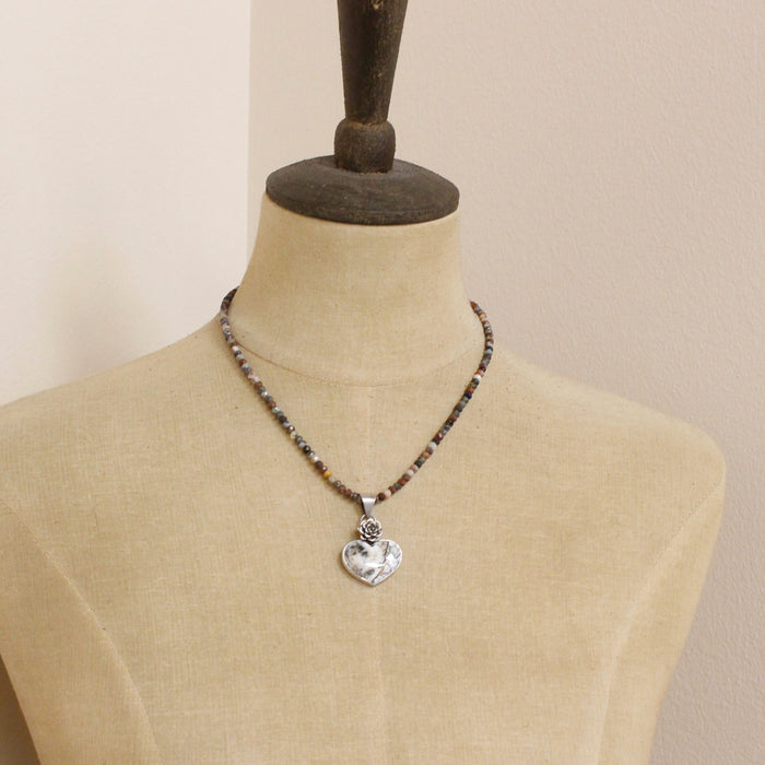 A mannequin wearing the mohave white buffalo turquoise heart and succulent necklace with the mixed gemstone chain option