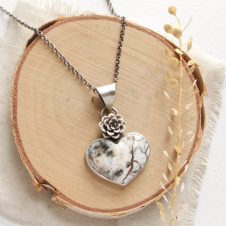 The mohave white buffalo turquoise heart and succulent necklace with the chain option styled on wood with linen and dried grass