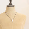 A mannequin wearing the organic pearl mixed metal necklace