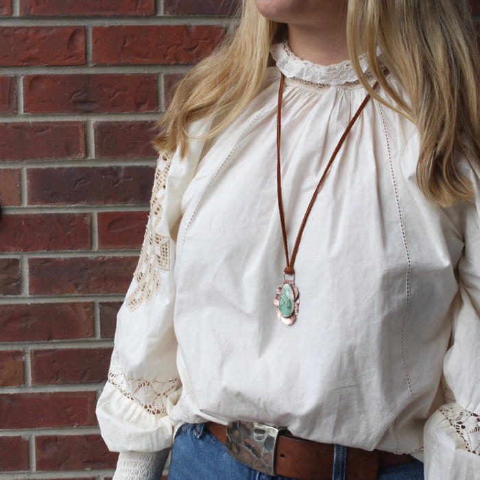 The organic variscite leather necklace being worn