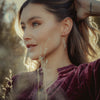 A model wearing the pearl wrapped oxidized silver vine earrings