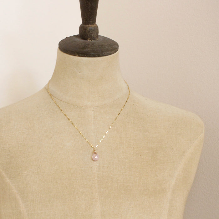 A mannequin wearing the morganite drop necklace
