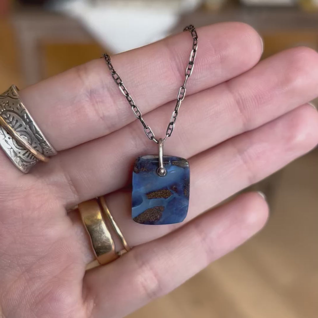 A video of the stunning boulder opal necklace to show the opal and flash