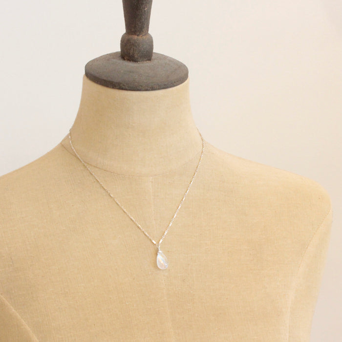 A mannequin wearing the rainbow moonstone silver bar necklace