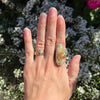 The royston turquoise statement ring being worn on a hand