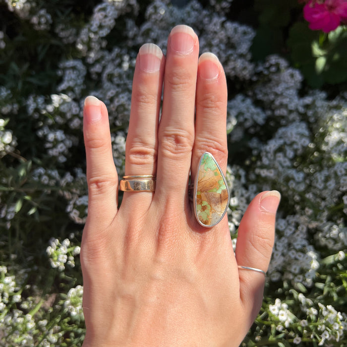 The royston turquoise statement ring being worn on a hand