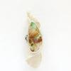 The stunning green and brown royston turquoise statement ring styled on rolled tan linen