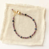The sapphire cleo bracelet styled on tan linen
