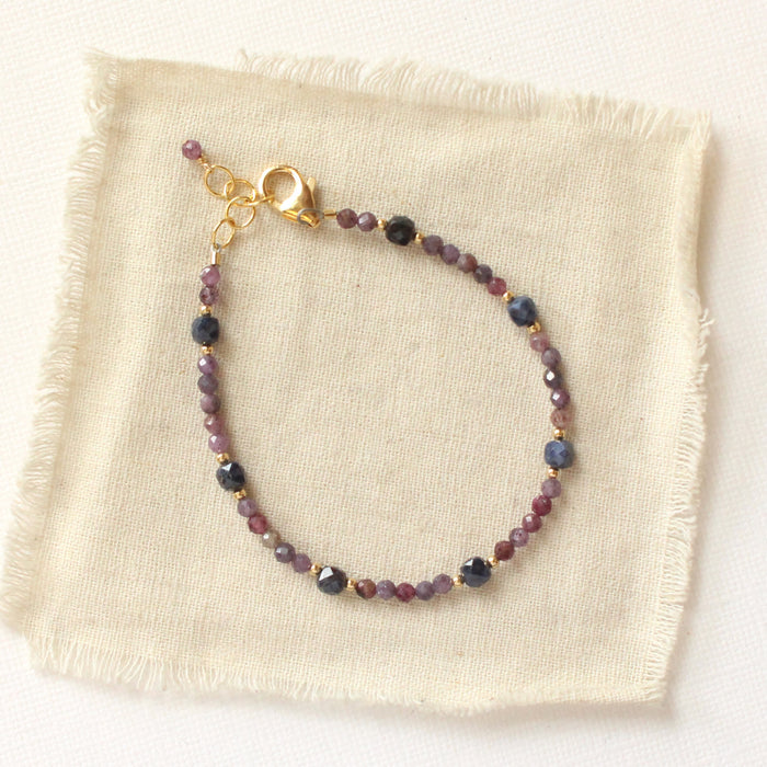 The sapphire cleo bracelet styled on tan linen