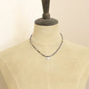 A mannequin wearing the sapphire and elephant necklace