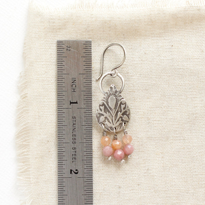 A shades of summer earring next to a ruler for size reference