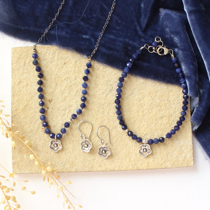 The mini cactus sodalite bracelet styled on a tan rock with the matching necklace and earrings