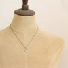 A mannequin wearing the wanderer hoop necklace