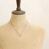 A mannequin wearing the mini talara sun necklace