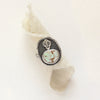 The little cactus turquoise ring styled on rolled linen
