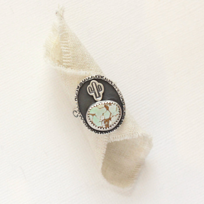 The little cactus turquoise ring styled on rolled linen