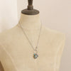 A mannequin wearing the royston turquoise heart charm necklace