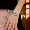 The turquoise heart cuff bracelet being worn on a wrist
