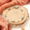 The bondi bracelet styled on wood with orange velvet and dried grass