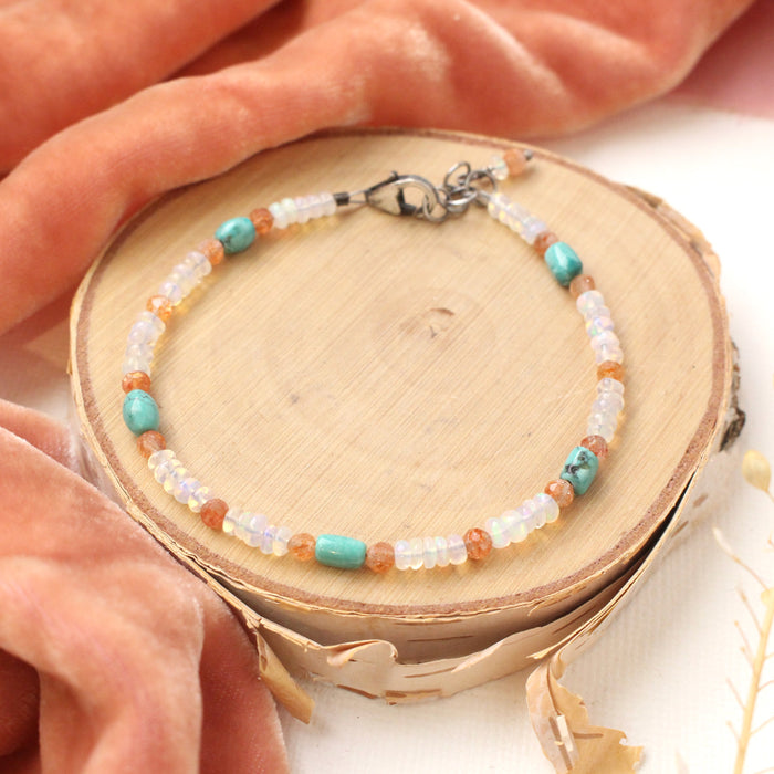 The bondi bracelet styled on wood with orange velvet and dried grass