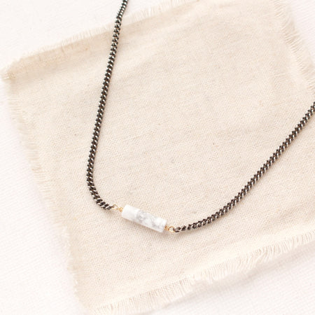 the sydney white howlite necklace styled on tan linen