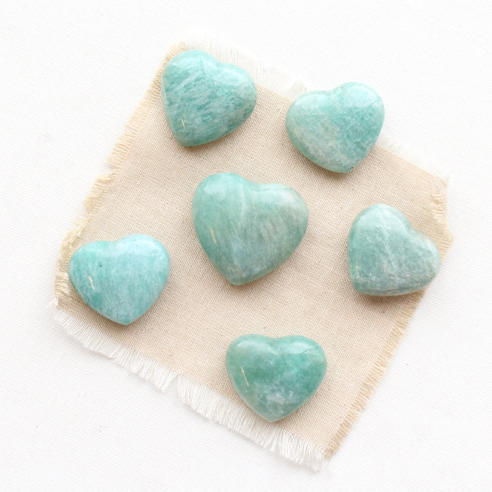 6 heart shaped Amazonite stones styled on tan linen