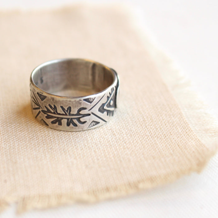 Stamped textured band of the silver buffalo ring
