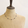 A mannequin wearing the lapis satellite mixed metal necklace