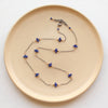 The elegant lapis satellite mixed metal necklace showing the adjustable lobster clasp closure