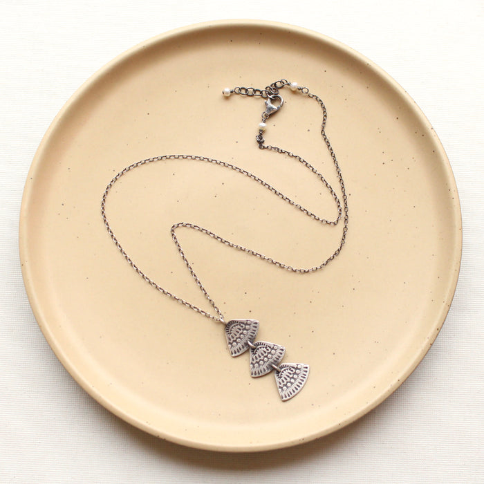 Stamped silver Asmi trio triangle necklace showing lobster clasp closure