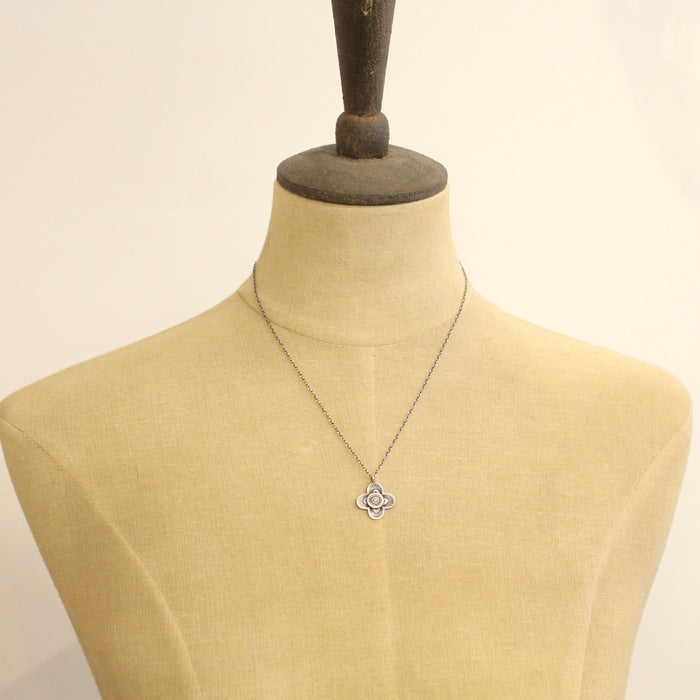 A mannequin wearing the layered talara necklace