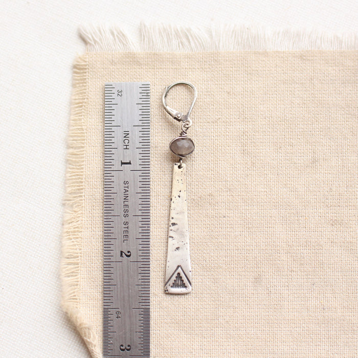 a pakal long triangle & labradorite earring next to a ruler for size reference