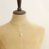 A mannequin wearing the perfect pearl gold necklace