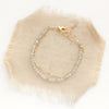 The labradorite double strand bracelet styled on tan linen