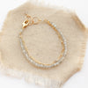 The labradorite double strand bracelet styled on tan linen