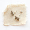 The mini talara post earrings styled to show the butterfly earbacks