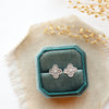 The mini talara post earrings styled on a blue velvet box with linen and dried grass