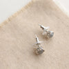 The silver wrapped labradorite post earrings styled to show the comfort clutch ear backs