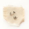 The talara sun post earrings styled to show the butterfly backs